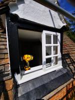 Dormer window sections replaced and primed