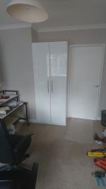 White gloss cupboard for files built into office