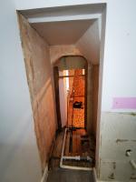 Ensuite bathroom in 1820's property going through refurbishment, revealing hidden doorway