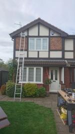Full replacement redwood fascia and gable boards treated in mahogany stain