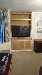Shaker style lounge cabinet with concealed electronics compartment