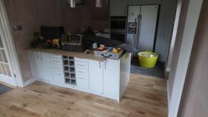 Sea Foam gloss kitchen installation, kitchen has been enlarged by stealing a part of adjacent bathroom, fully re-plastered and re-wired, new oak flooring