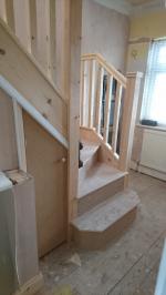 Pine square newel posts, square spindles, hdr handrails and pyramid caps, understairs cupboard