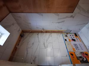 Bathroom being formed in a 17th century property having tiling