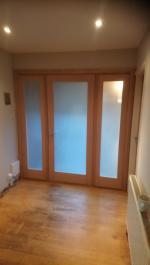 Oak pattern ten internal door with obscure glazing and flanking panels