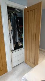 Built in wardrobe with oak Dordogne facade and integral drawers