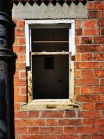 Wooden window casement having failing timbers removed