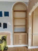 Shaker cupboard and shelves with arch-top detail