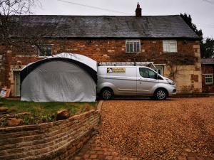 Pop-up tent outside character property on a dreary day
