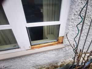 Flush window casement having sections removed for replacement