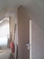 Flush ply door fitted into angled loftspace doorway