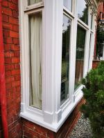 New corner posts and lower sections of a bay window