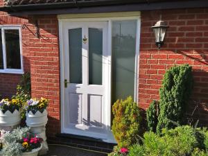Richmond obscure glazed external door and white laminated side light