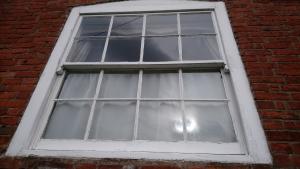 Sash window ready for refurbishment on Georgian farmhouse