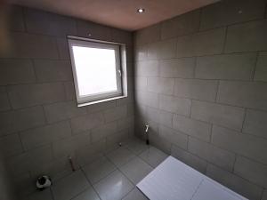 bathroom being refurbished, tiles grouted