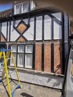 Oak Tudor-style paneling being replaced