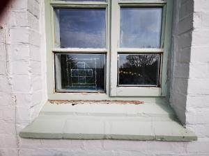 Wooden window casement ready for refurbishment