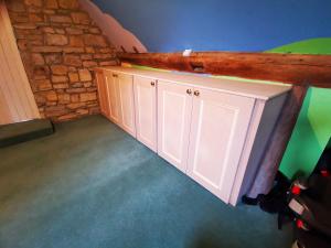 Low-level Victorian shaker style storage area formed in a 400 year old property