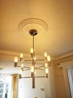 Modern lighting chandelier fitted in Georgian property with contemporaneous ceiling rose