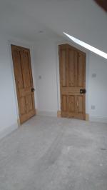 Salvaged pine doors fitted into loft conversion