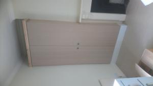 Wardrobes formed by chimney breast with vertical reed beading detail
