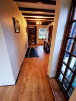 Laying engineered wood floor through an historic property hallway