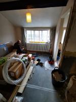 Column radiator fitted, bathroom being formed in a 17th century property