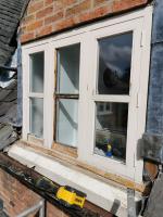 Flush casement having replacement sill, casement bases and mullions