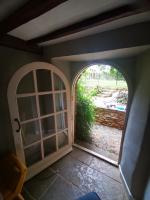 Arched-top Hobbit door being eased and draught proofed