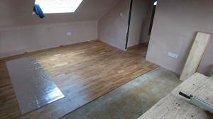 Laminate flooring being fitted as part of loft conversion second fix carpentry