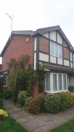 Full replacement redwood fascia and gable boards treated in mahogany stain