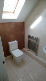 Faulty concealed cistern removed, new close coupled toilet installed, wall plastered