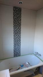 Bathroom plastered and bath fitted, undergoing tiling