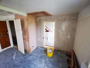 Staircase removed, stud-wall gypsum plastered, brick-wall lime plastered, doorway formed