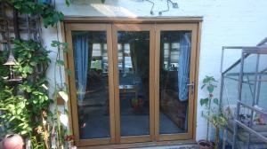 refurbishing well-weathered oak bi-fold doors