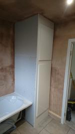 Bathroom plastered and bath fitted, white gloss boiler cupboard