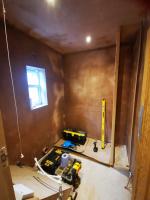Stripped bathroom plastered, ready for rebuilding