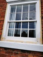 Sash window with replacement parts waiting for primer