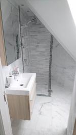 Loft bathroom with bespoke shower enclosure