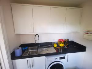 White gloss wall cabinets to match existing