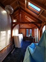 Insulating and rough-paneling the interior of an oak outbuilding