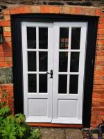 Replacement glazed french door set in primer