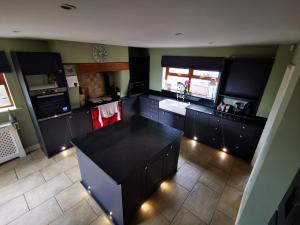 Kitchen paneling and door refit with remote control plinth lights