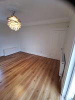 Extensively altered room finished in rustic oak flooring
