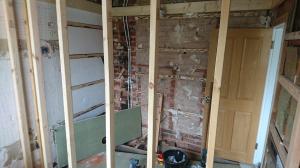 Partition wall being built to split one bathroom into two