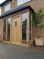 Glass and oak porch with cottage door