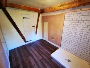Bathroom refurbishment in a 17c property, underfloor heating laid, LVT flooring, shiplap aqua boards