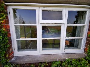Wooden window casement having had new centre casement base rebuild, new cill and putty