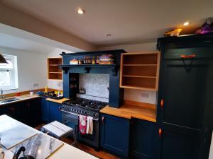 Forming cupboards to match surrounding painted kitchen