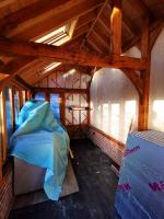 Insulating and rough-paneling the interior of an oak outbuilding